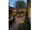 Spacious back patio with a pergola, string lights, and ample seating for outdoor dining and relaxation at 5018 E Kathleen Rd, Scottsdale, AZ 85254