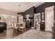 Elegant dining room featuring modern lighting, stylish seating, and hardwood floors at 5018 E Kathleen Rd, Scottsdale, AZ 85254