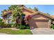 Beautiful single-story home with lush landscaping and a well-maintained front yard on a sunny day at 5018 E Kathleen Rd, Scottsdale, AZ 85254