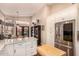 Spacious kitchen with island, stainless steel appliances, white cabinets, and breakfast nook at 5018 E Kathleen Rd, Scottsdale, AZ 85254