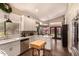 Bright kitchen with white cabinets, granite countertops, stainless steel appliances and eat-in breakfast nook at 5018 E Kathleen Rd, Scottsdale, AZ 85254