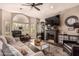 Comfortable living space featuring stylish decor, a cozy fireplace, and an abundance of natural light at 5018 E Kathleen Rd, Scottsdale, AZ 85254