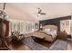 Well-appointed main bedroom features vaulted ceilings, shuttered windows, and dark accent wall at 5018 E Kathleen Rd, Scottsdale, AZ 85254