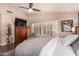 Relaxing main bedroom features plantation shutters, wood floors, and lots of natural light at 5018 E Kathleen Rd, Scottsdale, AZ 85254