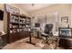 Inviting home office featuring a large window, custom desk, and shelving for storage at 5018 E Kathleen Rd, Scottsdale, AZ 85254
