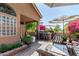 Charming patio featuring an outdoor kitchen, comfortable seating, and beautiful landscaping for entertaining at 5018 E Kathleen Rd, Scottsdale, AZ 85254
