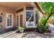 Inviting outdoor patio with comfortable seating, a cozy bench, and a lush garden view at 5018 E Kathleen Rd, Scottsdale, AZ 85254
