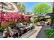 Beautiful outdoor patio with elegant seating and pink Bougainvillea, perfect for relaxation at 5018 E Kathleen Rd, Scottsdale, AZ 85254