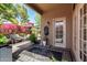 Charming outdoor patio with Bougainvillea, seating, and a custom water feature for relaxation at 5018 E Kathleen Rd, Scottsdale, AZ 85254