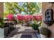 Beautiful outdoor patio with pink Bougainvillea, seating, and decorative water feature for a serene setting at 5018 E Kathleen Rd, Scottsdale, AZ 85254
