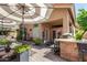 Inviting outdoor space with a built-in grill, patio furniture, and a shade umbrella for entertaining guests at 5018 E Kathleen Rd, Scottsdale, AZ 85254