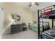 Bedroom with a basketball hoop, ceiling fan, and bright natural light at 556 W Sagebrush St, Gilbert, AZ 85233