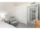 Bedroom featuring a slider closet, access to the ensuite, and reading nook at 556 W Sagebrush St, Gilbert, AZ 85233