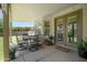 Well-appointed covered patio with dining and seating areas, perfect for enjoying the outdoors at 556 W Sagebrush St, Gilbert, AZ 85233