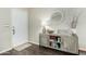 Inviting entryway showcasing a stylish cabinet, decor, and light wood-look flooring at 556 W Sagebrush St, Gilbert, AZ 85233