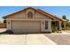 Charming single-story home featuring a spacious garage, tile roof, and low-maintenance desert landscaping at 556 W Sagebrush St, Gilbert, AZ 85233