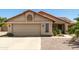 Charming single-story home featuring a two-car garage, desert landscaping, and a tile roof at 556 W Sagebrush St, Gilbert, AZ 85233
