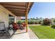 Charming covered patio and manicured lawn in a private backyard setting at 630 E Jensen St # 116, Mesa, AZ 85203