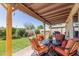 Inviting backyard patio with cozy seating and lush green landscaping at 630 E Jensen St # 116, Mesa, AZ 85203