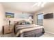 Comfortable bedroom with ceiling fan, carpeted floor, and windows providing ample natural light at 630 E Jensen St # 116, Mesa, AZ 85203