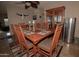 Inviting dining room features a wood table, six chairs, a hutch, and stylish décor at 630 E Jensen St # 116, Mesa, AZ 85203