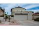This charming home boasts a two-car garage and a stucco exterior, perfect for desert living at 630 E Jensen St # 116, Mesa, AZ 85203