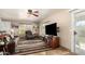 Relaxing living room offers natural light, comfortable seating, a fireplace, and a ceiling fan at 630 E Jensen St # 116, Mesa, AZ 85203