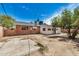 A brick home with concrete slab and block wall situated in its backyard at 6312 N 41St Ave, Phoenix, AZ 85019