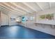 Large bonus room with natural lighting, blue painted floor and white ceiling at 6312 N 41St Ave, Phoenix, AZ 85019