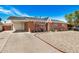 Cozy brick house with a covered parking area and a tidy gravel front yard, complete with a charming white front door at 6312 N 41St Ave, Phoenix, AZ 85019