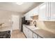 Bright kitchen features white cabinets, granite countertops, a stainless steel refrigerator and undermounted sink at 6312 N 41St Ave, Phoenix, AZ 85019