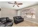 Inviting living room featuring neutral paint, ceiling fan, tile flooring, and comfortable seating with a nice view at 6312 N 41St Ave, Phoenix, AZ 85019