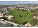 Great aerial view of the neighborhood park with playground, green space, and walking paths for community enjoyment at 6462 E Raftriver St, Mesa, AZ 85215