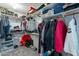 Walk-in closet with ample shelving and hanging space for organized storage solutions at 6462 E Raftriver St, Mesa, AZ 85215