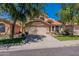 Two-story home featuring a red tile roof, a well-manicured lawn, and a spacious two-car garage at 6462 E Raftriver St, Mesa, AZ 85215