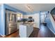 Bright kitchen has white cabinets, stainless appliances, granite counters, and seamless flow into dining at 6462 E Raftriver St, Mesa, AZ 85215