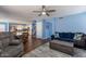 Open living area has wood flooring, blending kitchen, dining, and living spaces for modern living at 6462 E Raftriver St, Mesa, AZ 85215