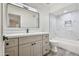 Bathroom with vanity, large mirror, and a tiled shower/tub combo at 6739 E Thunderbird Rd, Scottsdale, AZ 85254