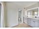 Bright bathroom boasts a dual sink vanity with modern lighting and fixtures at 6739 E Thunderbird Rd, Scottsdale, AZ 85254