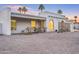 Charming, single-story home with stucco walls and lush palm trees against a beautiful dusk sky at 6739 E Thunderbird Rd, Scottsdale, AZ 85254