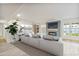 Bright living room featuring a modern fireplace, cozy seating, and stylish decor at 6739 E Thunderbird Rd, Scottsdale, AZ 85254