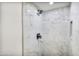 Tiled shower features matte black hardware and a built-in niche at 6739 E Thunderbird Rd, Scottsdale, AZ 85254