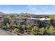 An aerial view of these condos reveals multiple balconies, lush landscaping, and mountain views at 7151 E Rancho Vista Dr # 3001, Scottsdale, AZ 85251