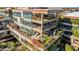 Aerial view of a multi-story building with rooftop gardens and private balconies at 7151 E Rancho Vista Dr # 3001, Scottsdale, AZ 85251