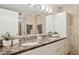 Bathroom with double sink vanity, granite countertops, and modern lighting at 7151 E Rancho Vista Dr # 3001, Scottsdale, AZ 85251