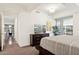 Well-lit bedroom showing access to the dining room, and a balcony area at 7151 E Rancho Vista Dr # 3001, Scottsdale, AZ 85251