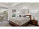 Spacious bedroom with large windows offering ample natural light and courtyard view at 7151 E Rancho Vista Dr # 3001, Scottsdale, AZ 85251