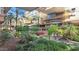 Lush landscaping with palm trees and colorful flowers adorn this building's beautiful common area at 7151 E Rancho Vista Dr # 3001, Scottsdale, AZ 85251