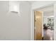 Hallway view of the living room featuring neutral paint and modern lighting at 7151 E Rancho Vista Dr # 3001, Scottsdale, AZ 85251