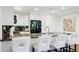 Stylish kitchen with barstool seating and a black stainless refrigerator at 7151 E Rancho Vista Dr # 3001, Scottsdale, AZ 85251